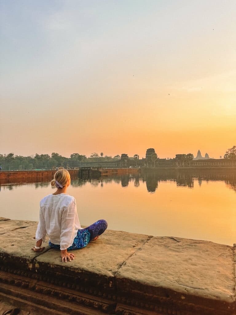 Watching sunrise over the moat at Angkor Wat, Cambodia