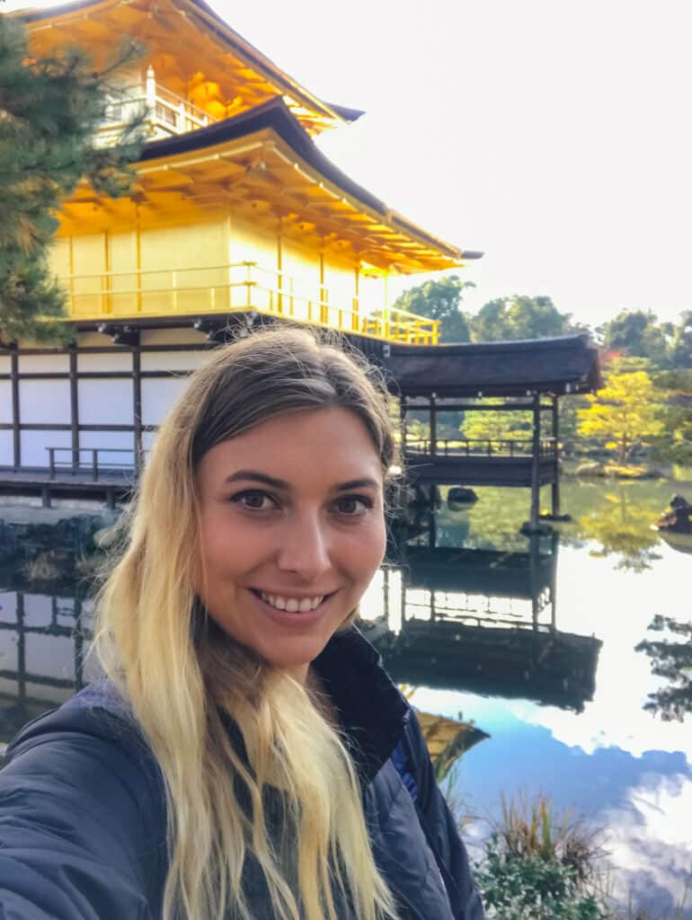 Blogger posing in front of the Kinkakuji Golden Pavilion reflection, Kyoto