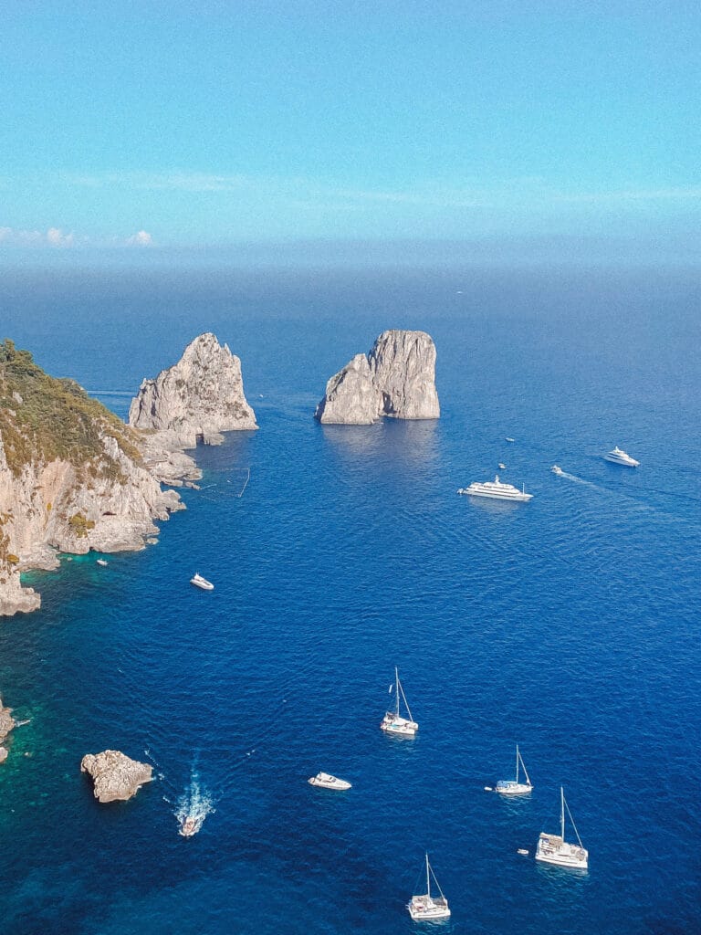 Boats in front of the faraglioni on Capri