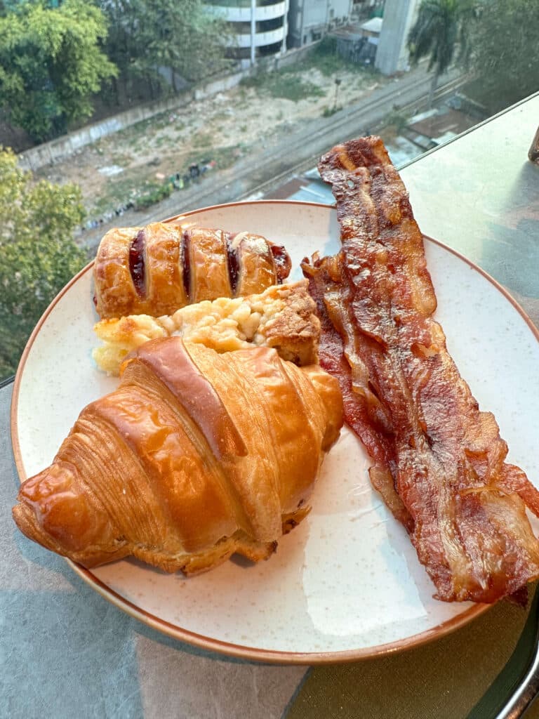 Western breakfast with crispy bacon and buttery croissant at the Eastin Grand Hotel Phayathai buffet