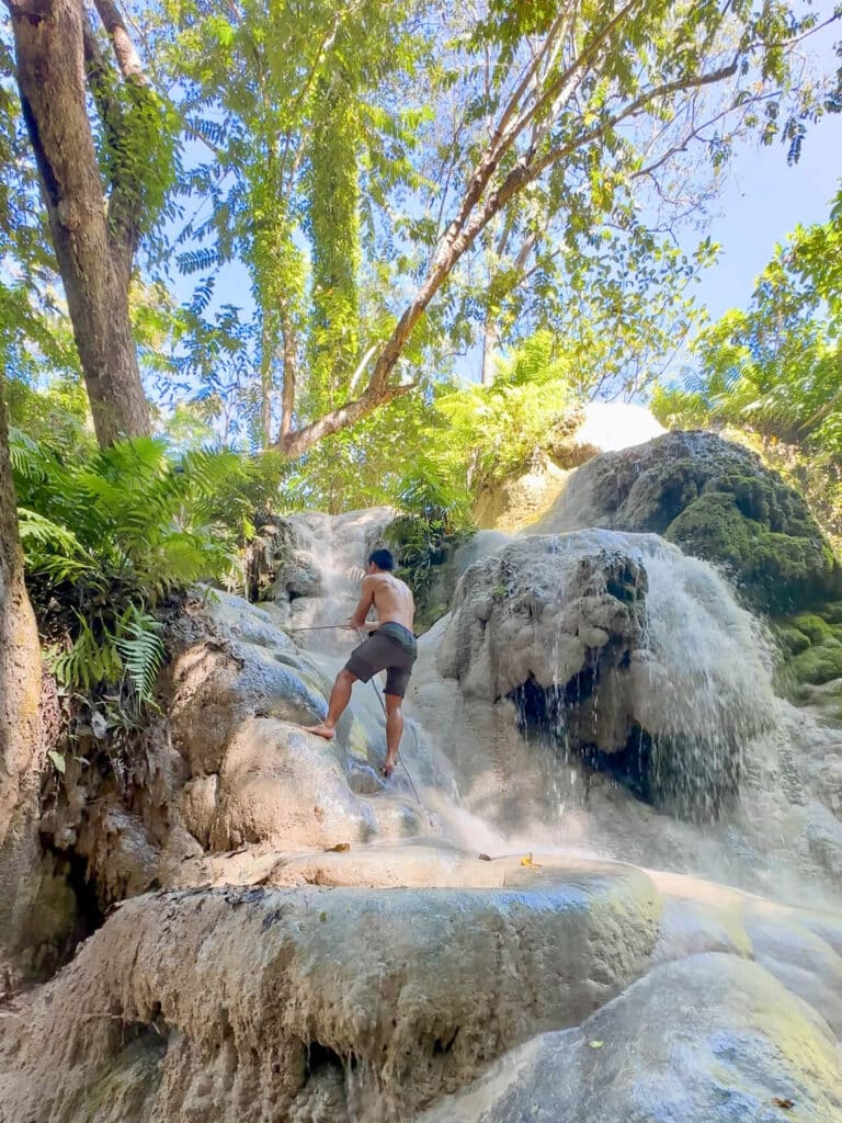 Using a rope for support on one of the steeper waterfall sections.