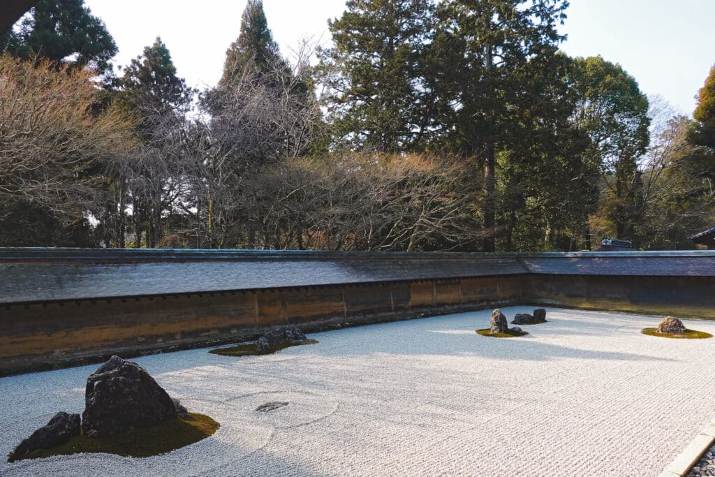 Artfully raked gravel at the Zen rock garden at Ryoan-ji temple in Kyoto