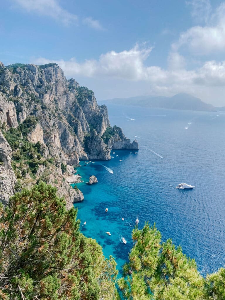 Cliffside vegetation and turquoise sea near the Piazzette delle Noci, Capri