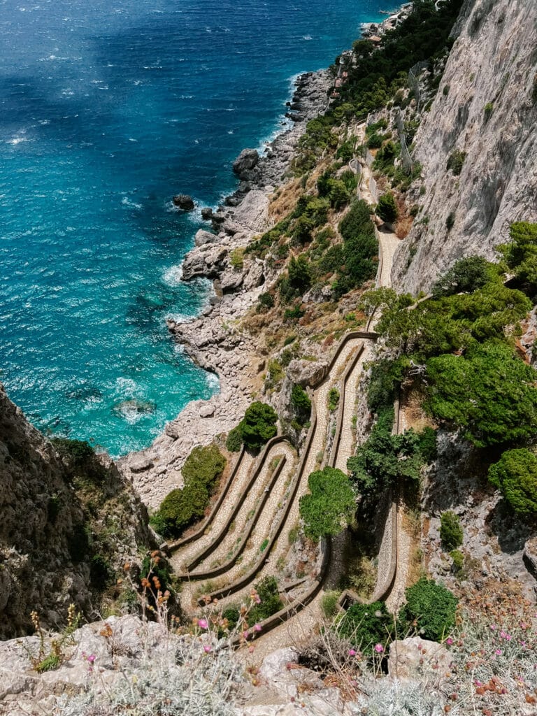 Looking down at the winding switchbacks of Via Krupp carved into the cliffside