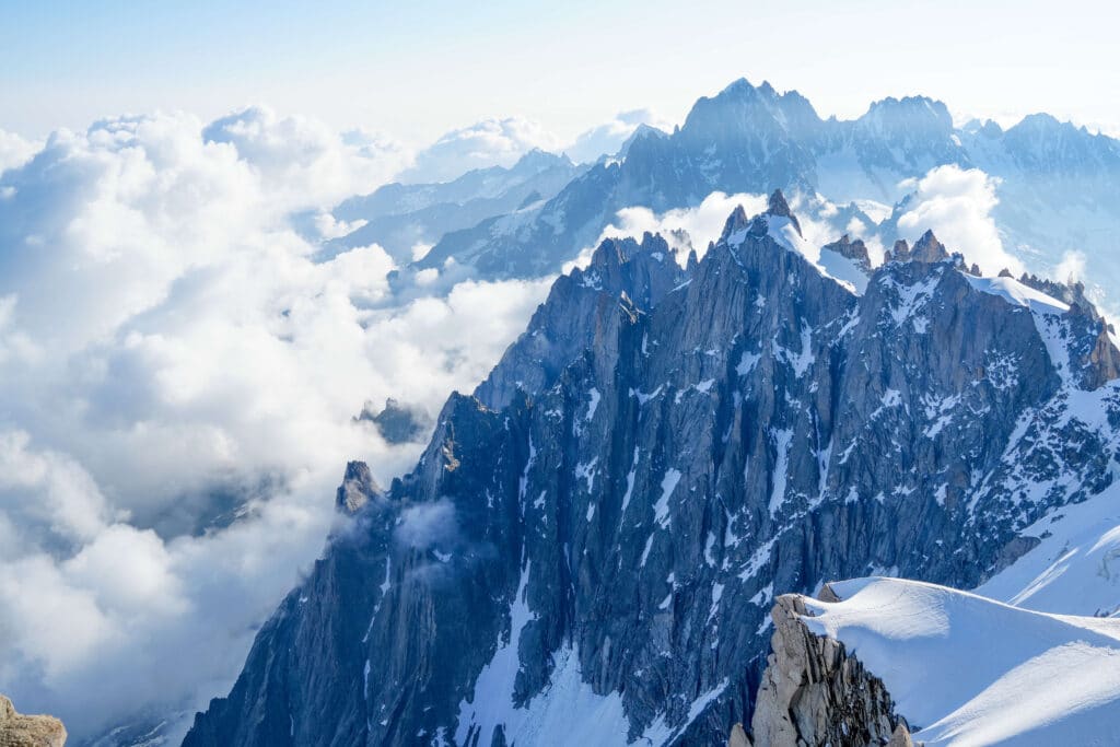 Rocky spires against fluffy white clouds
