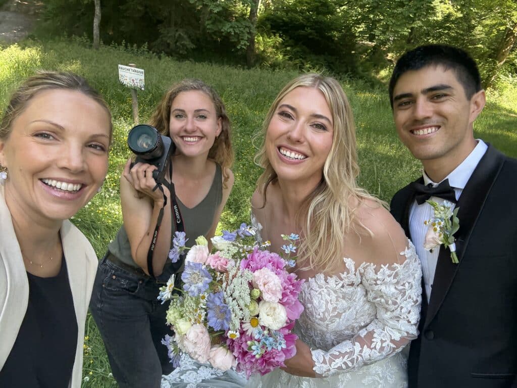 Bride and groom with Laura and Mathilde smiling after the ceremony, a dream team selfie!