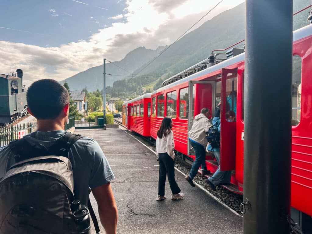 Travelers boarding the Montenvers red cogwheel train at the base station in Chamonix