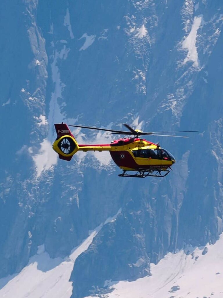 Red and yellow search and rescue helicopter