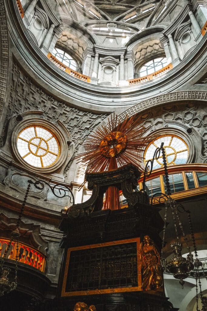 View of the Chapel of the Holy Shroud altar, with spiraling dome tiers above in the Royal Palace of Turin.