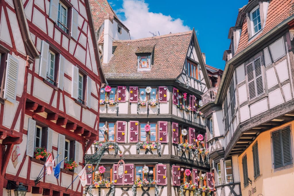 Iconic Maison Pfister building with ornate wood carvings and colorful half-timbered facade