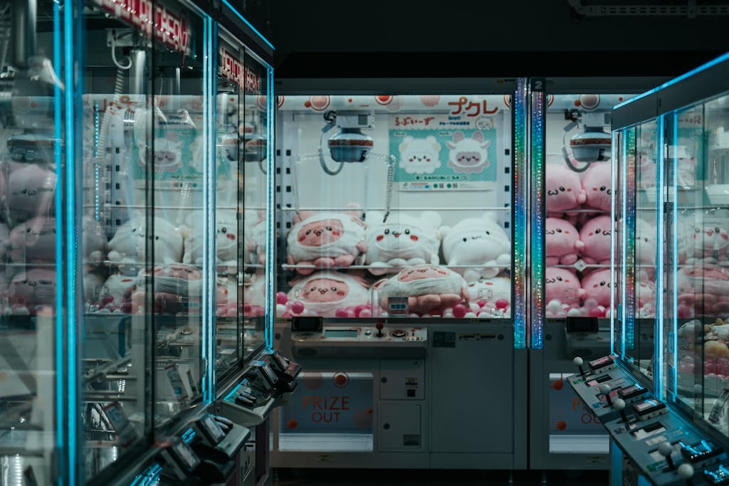 A vibrant shot of Japanese arcade claw machines filled with plush toys, highlighting urban leisure.
