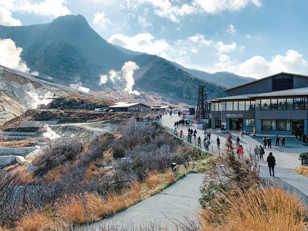 Amazing landscape of national park with volcanic mountainous terrain with fume mist crowded with tourists and located in Hakone Japan
