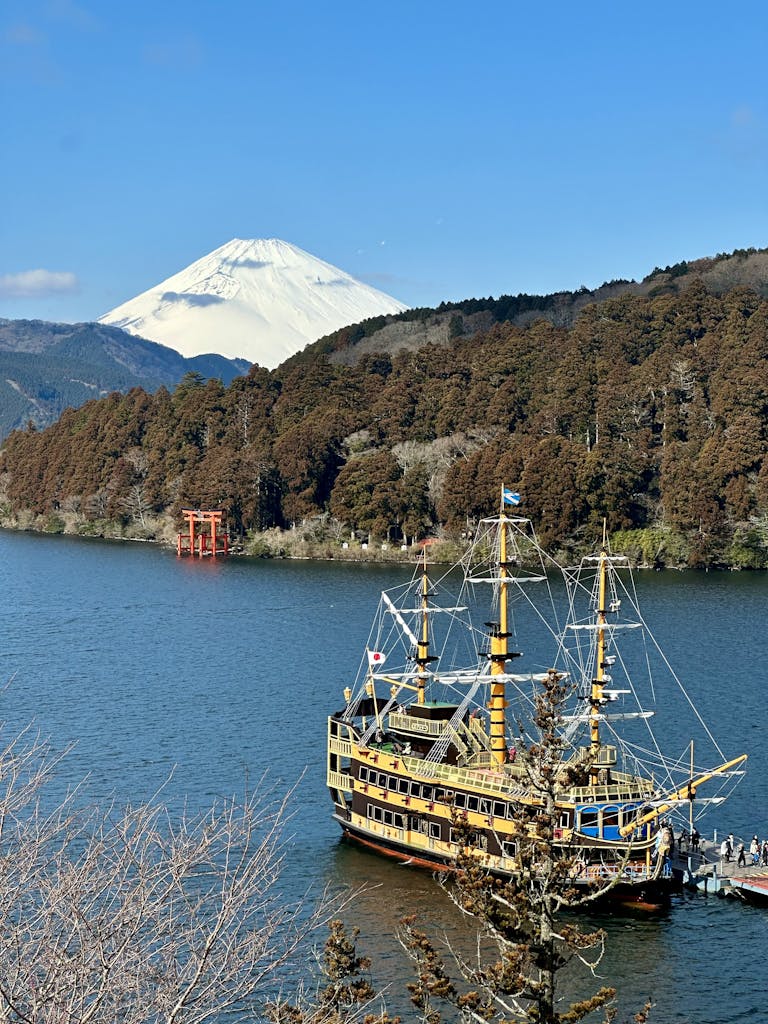 Captivating vista of Lake Ashi and Mount Fuji with a pirate ship in Hakone, Japan.
