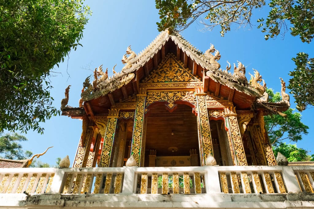 Ornate temple building at Wat Phra That Doi Suthep under clear blue skies
