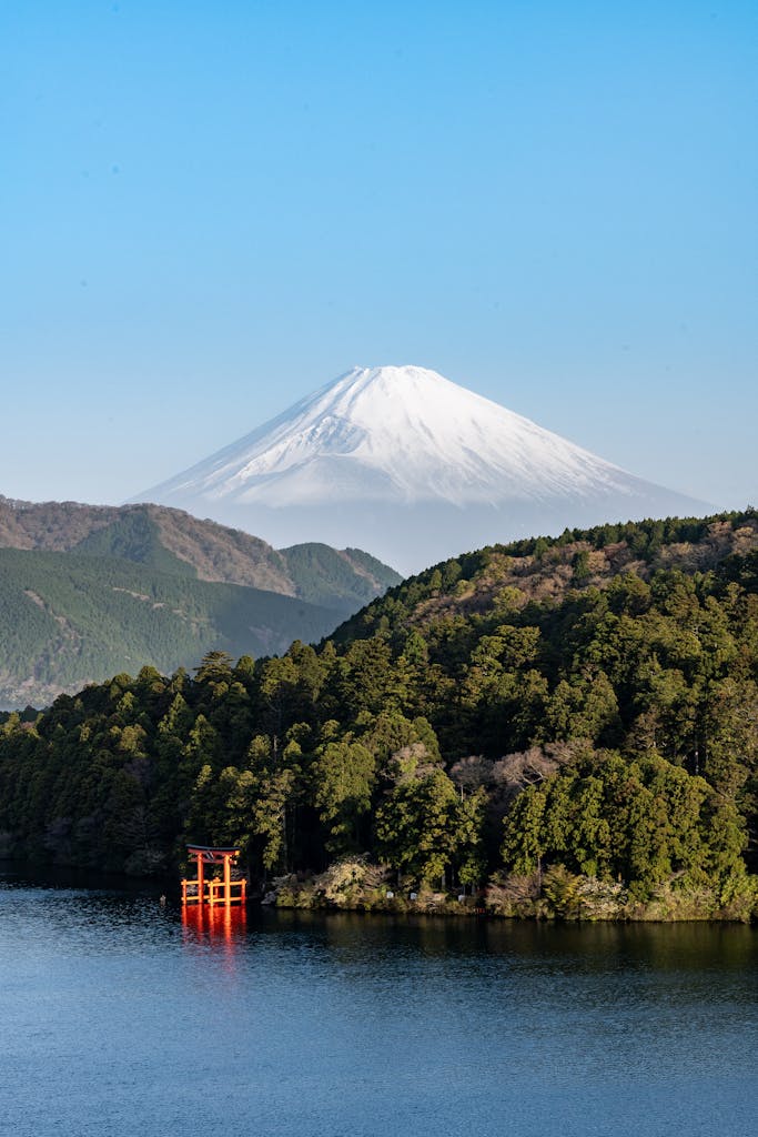 Stunning view of Mount Fuji with a red torii gate on Lake Ashi in Hakone, Japan.