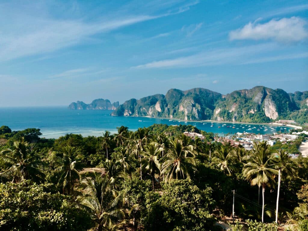A panoramic view of Phi Phi Island’s twin bays and surrounding limestone peaks, seen from an elevated lookout.