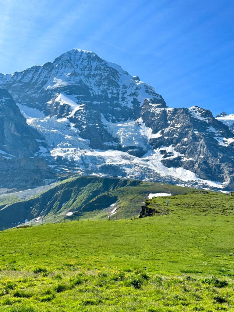 View of the Eiger Glacier and rugged alpine slopes near Kleine Scheidegg on a clear summer day