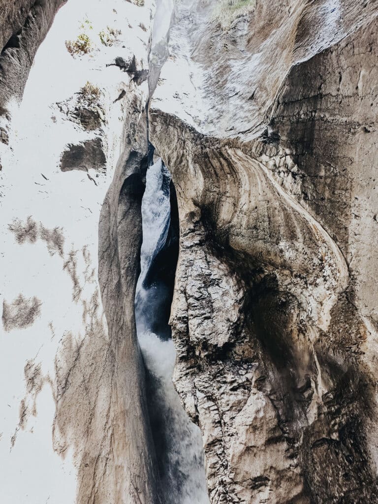 Underground gorge at Trümmelbach Falls with glacial water rushing through rock walls