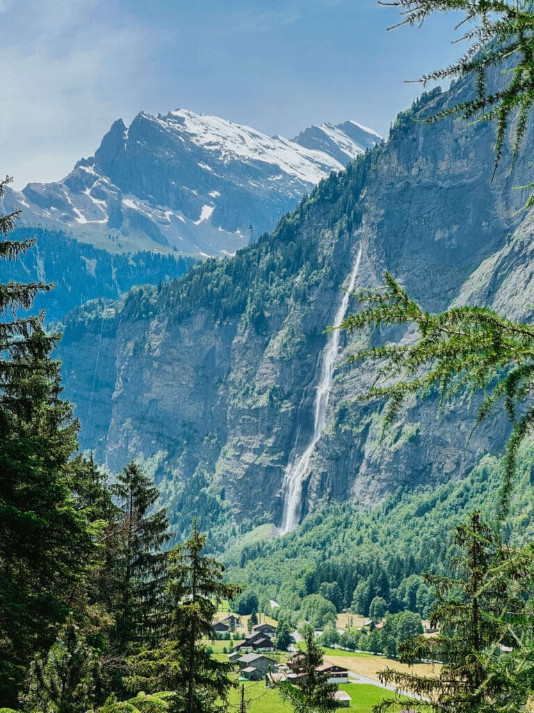 View of Lauterbrunnen Valley with alpine cliffs and waterfalls cascading into the valley below