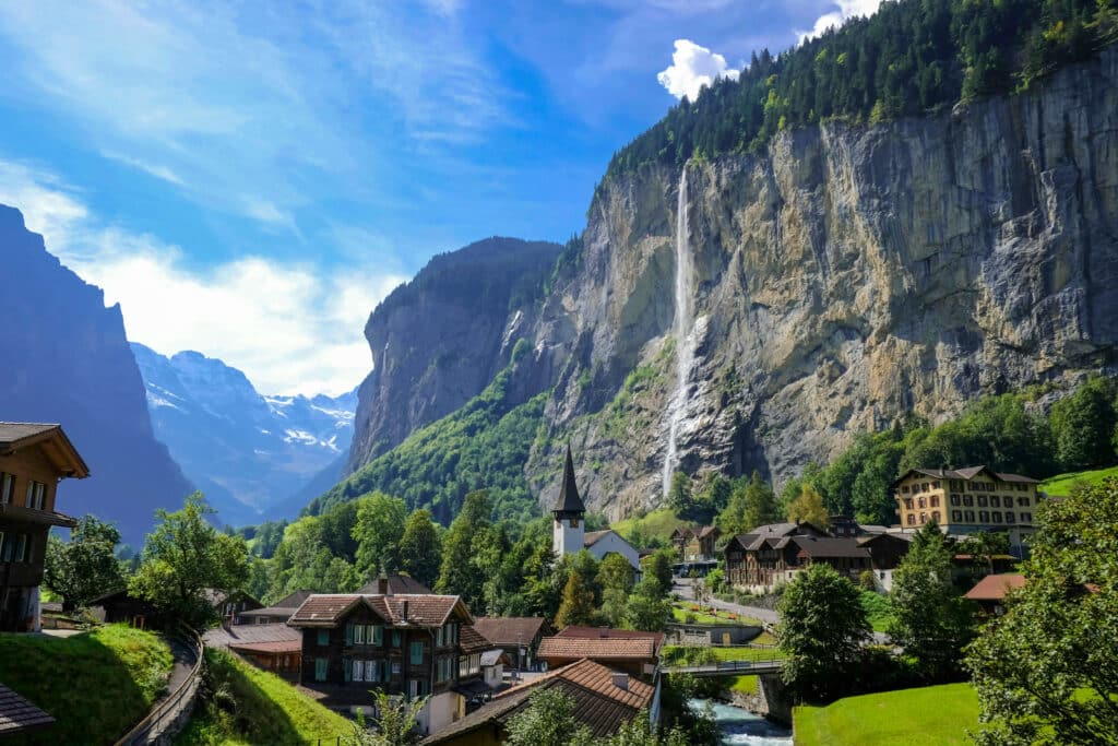 Lauterbrunnen valley with a view of the church in front of the famous Staubbach Waterfall