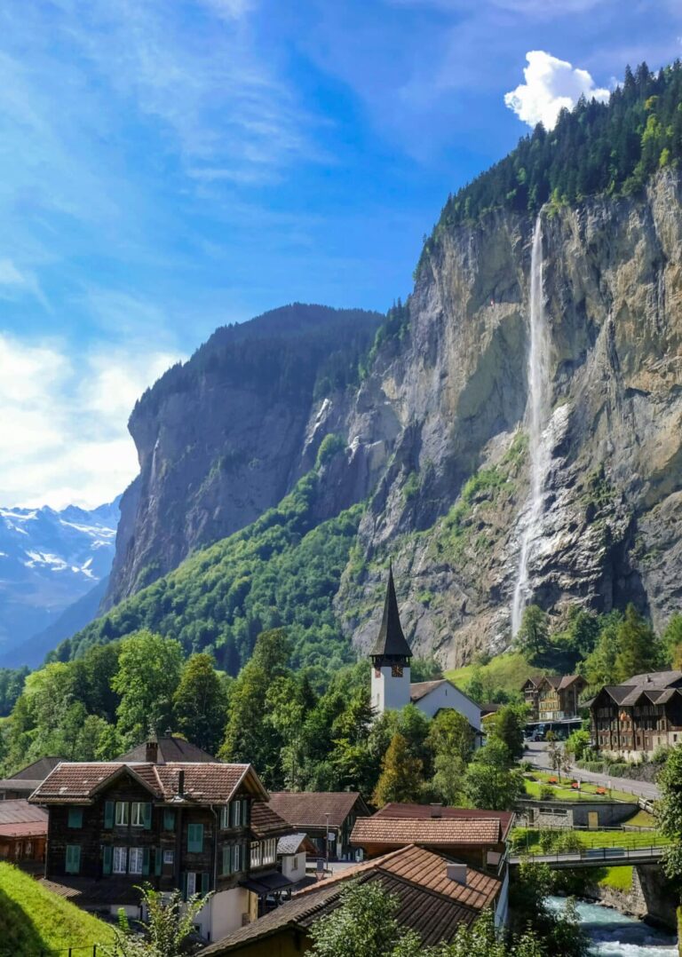 Lauterbrunnen valley with a view of the church in front of the famous Staubbach Waterfall