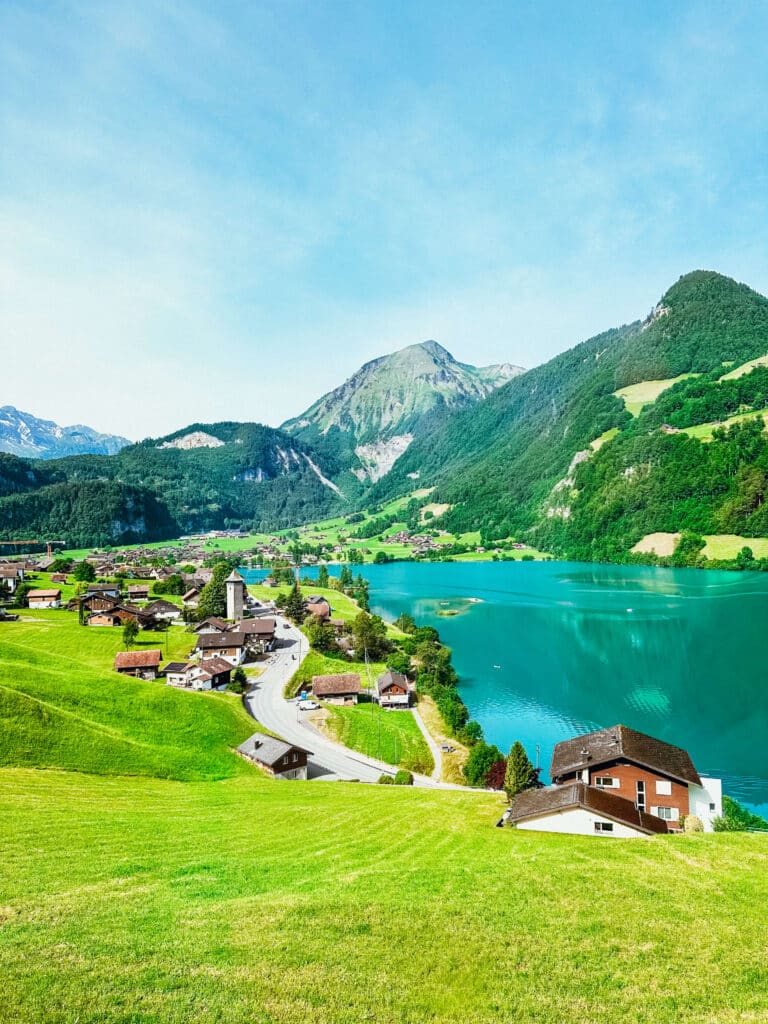 Aerial-style view of alpine lakes and villages in the Jungfrau Region surrounded by green hills
