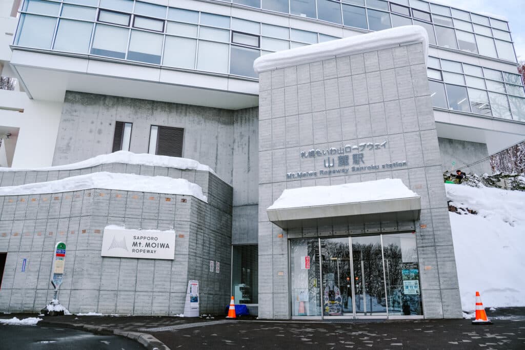 Mt. Moiwa Ropeway base station entrance in Sapporo with snow piled on the roof.