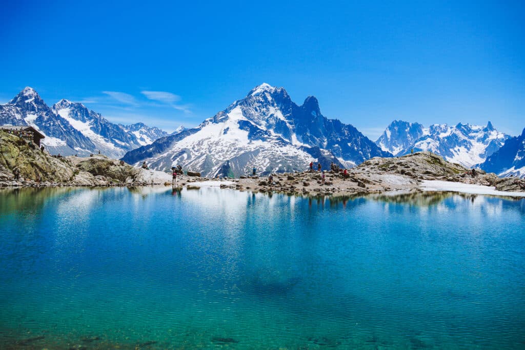 Lac Blanc reflecting Mont Blanc and the surrounding peaks in glassy turquoise water on a still summer morning, Chamonix