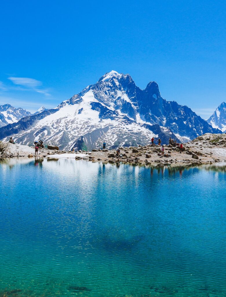 Sparkling blue water framed by snowy mountains at Lac Blanc in Chamonix, French Alps