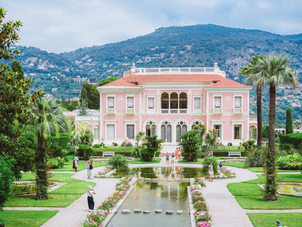 The formal French garden at Villa Ephrussi de Rothschild, where perfectly trimmed hedges and fountains lead the eye toward the sea.