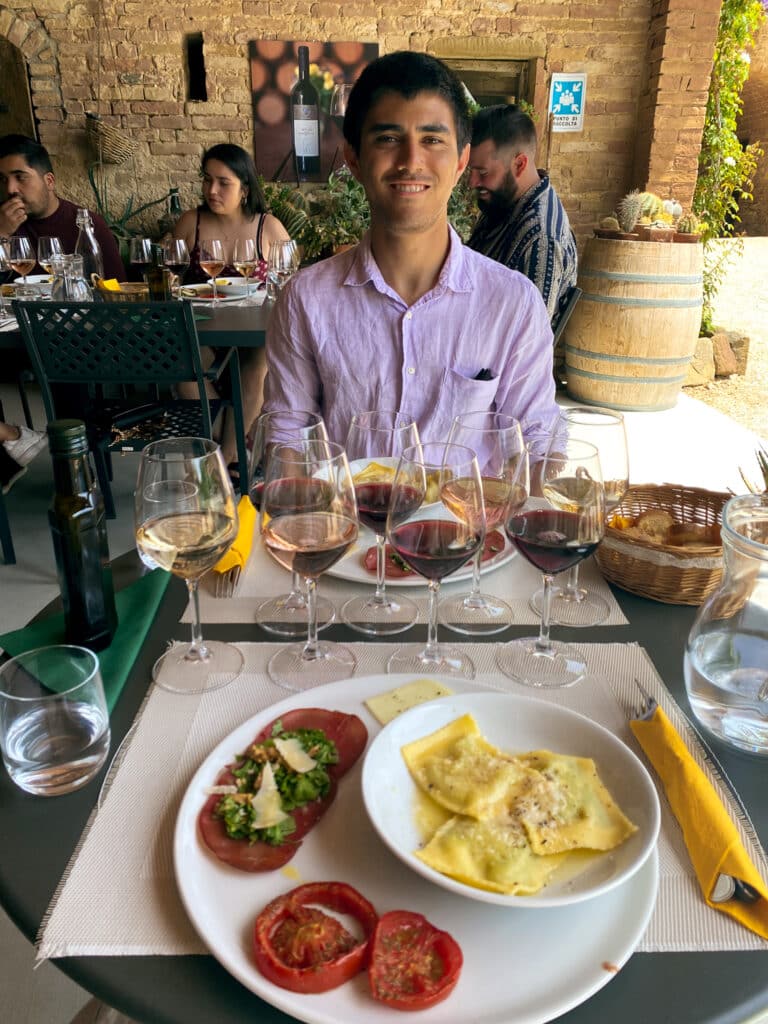 uscan wine tasting lunch with ravioli, caprese, and a flight of local wines at Agriturismo Marciano outside Siena.