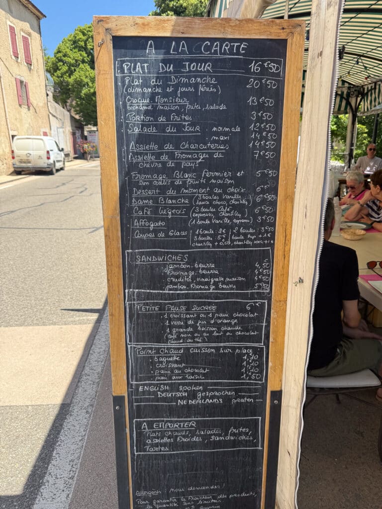 French chalkboard menu listing the day's specials at a café terrace in Sault village, Provence