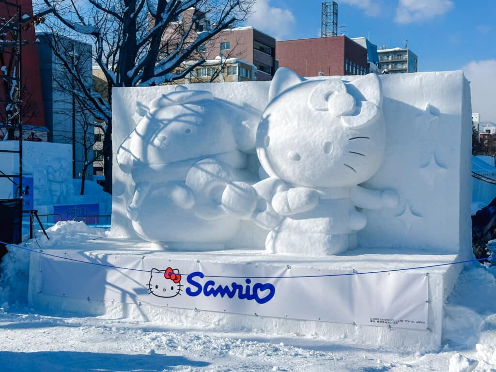 Hello Kitty and Sanrio characters carved in white snow at Odori Park, Sapporo Snow Festival, Hokkaido, Japan