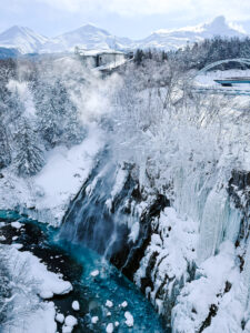 Shirahige Waterfall, a stop on our 2 week Hokkaido Itinerary. See the best of Hokkaido in 14 days.